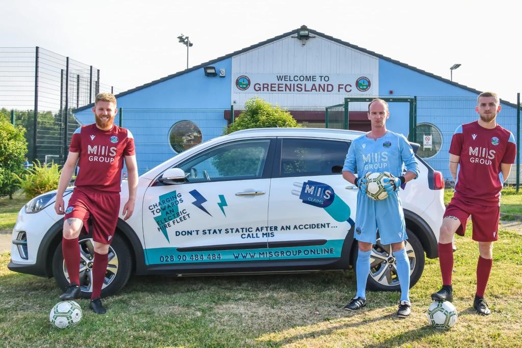 Members of Greenisland Football club pictured with the MIS Claims Electric Vehicle at the Greenisland Football Club grounds. 